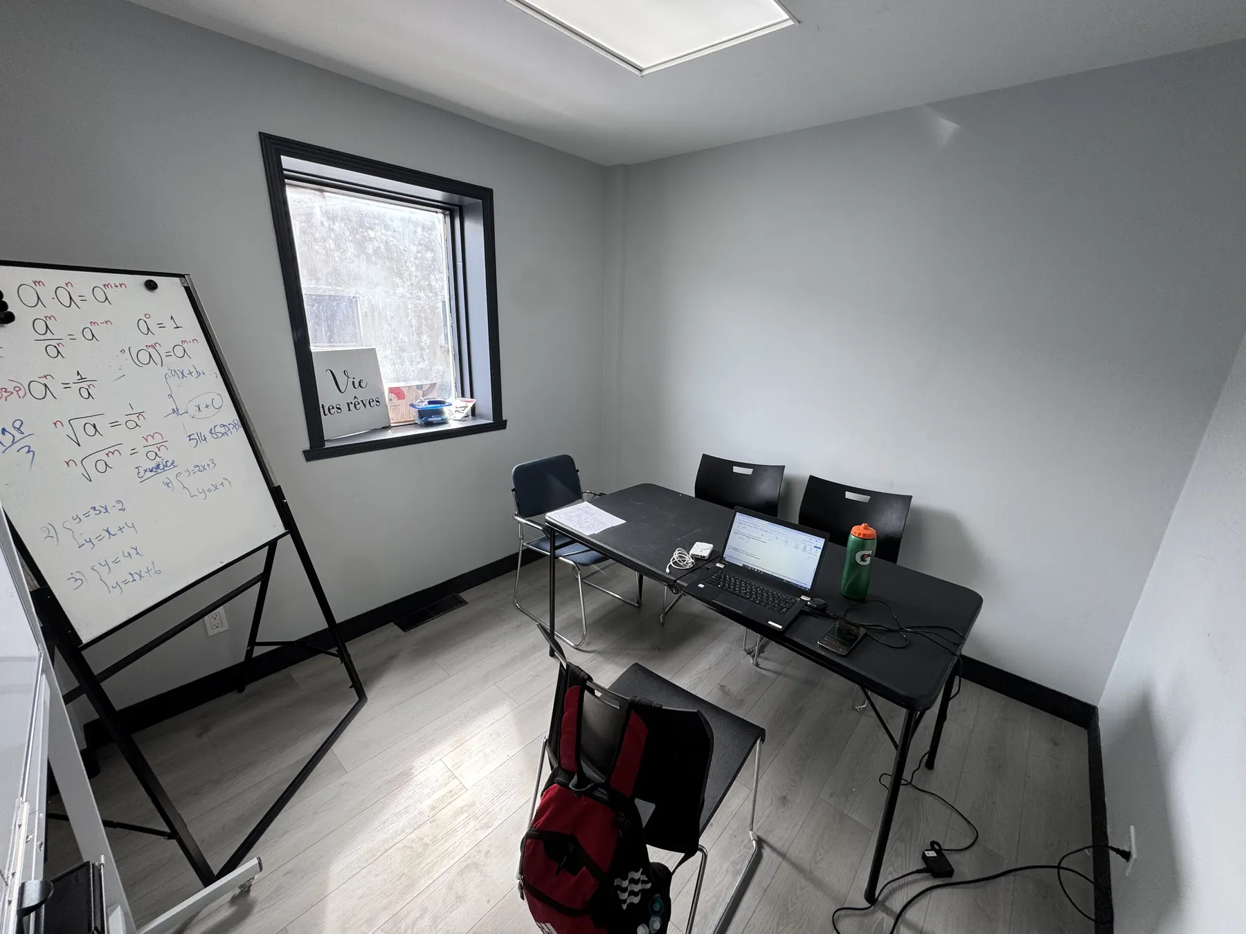 A C.A.U.S.E. classroom with tables, chairs, and learning materials