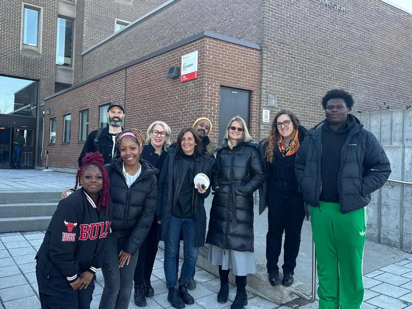 Studio 4 MTL students and partners gather outside during Francofête at McGill
